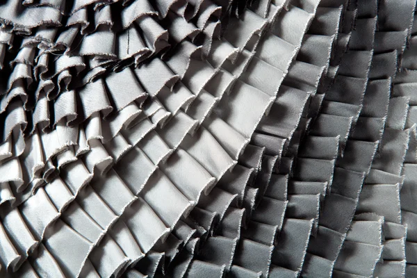 Grijze gegolfde rok geplooid textuur — Stockfoto