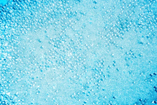 Kristallenglas parels weinig ballen textuur op blauw — Stockfoto