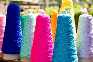 Embroidery colorful thread spools clipart