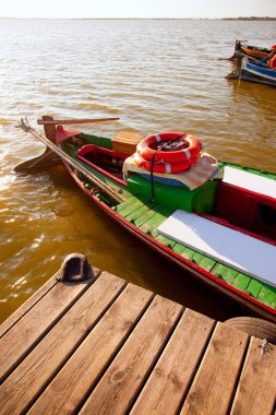 Albufera lake traditional boats in Valencia clipart