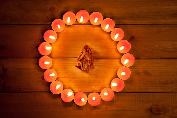 Chirstmas candles circle over wood and symbol — Stock Photo, Image