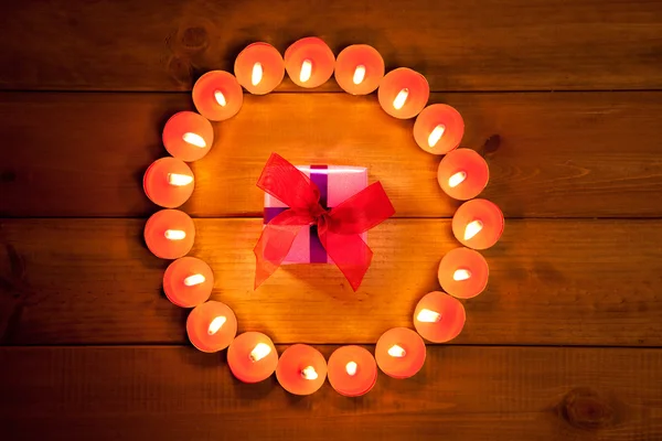 Chirstmas candles circle over wood and symbol — Stock Photo, Image