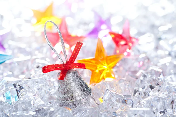 Christmas silver bell on winter ice — Stock Photo, Image