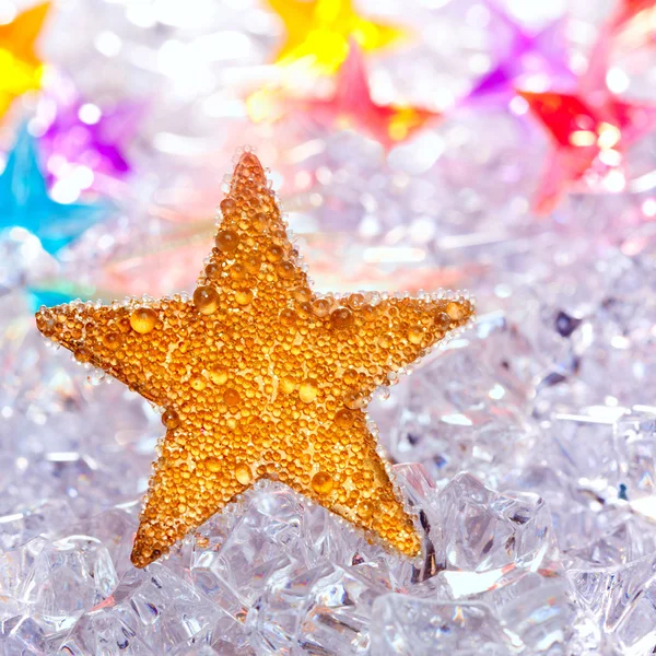 Christmas stars in ice background — Stock Photo, Image