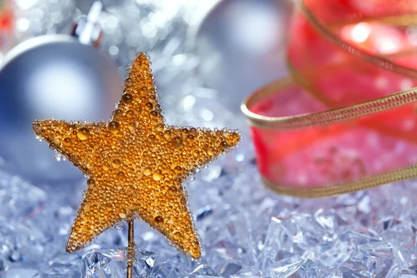 Natale stella d'oro simbolo argento bagattelle — Foto Stock