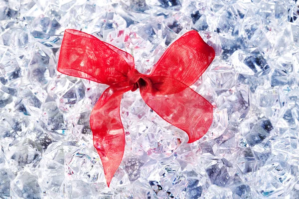Christmas gift ribbon loop on winter ice — Stock Photo, Image