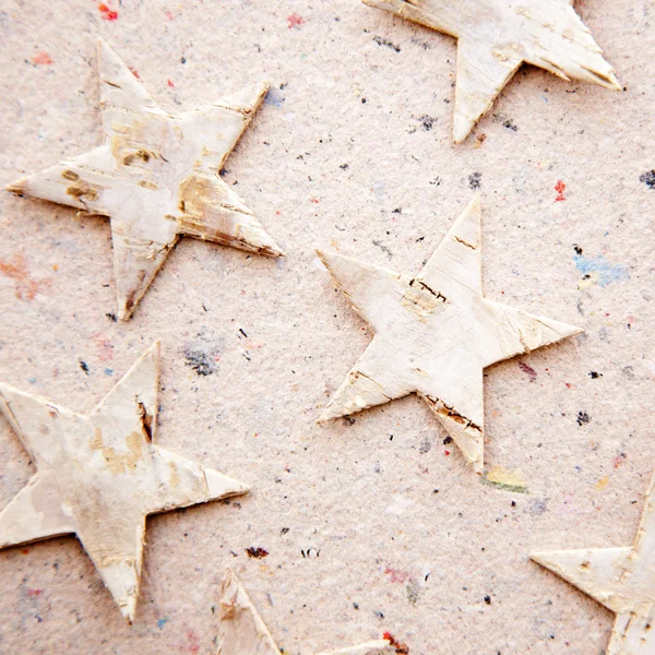 Chritmas αστέρια σε ανακυκλωμένο χαρτί φόντο — Φωτογραφία Αρχείου