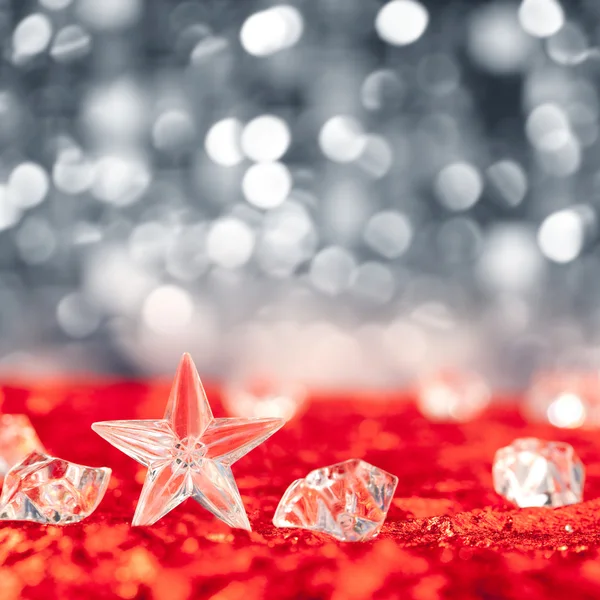 Christmas crystal star on ice cubes — Stock Photo, Image