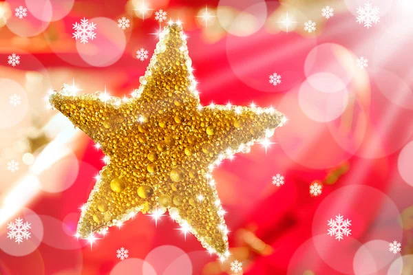 Christmas golden drops star in red — Stock Photo, Image