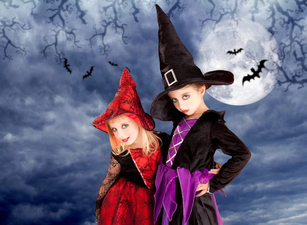 Halloween costumes kid girls on moon night — Stock Photo, Image