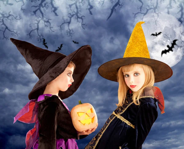 Halloween kid girls and pumpkin in moon sky — Stock Photo, Image