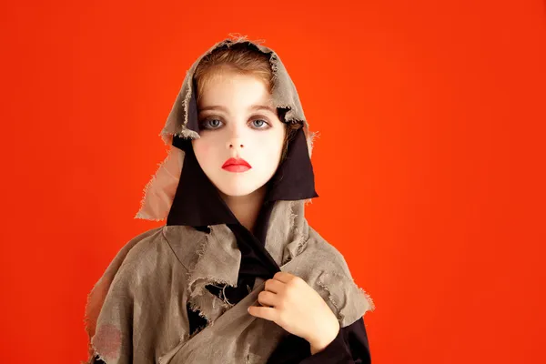 Halloween kid meisje kostuum op oranje — Stockfoto