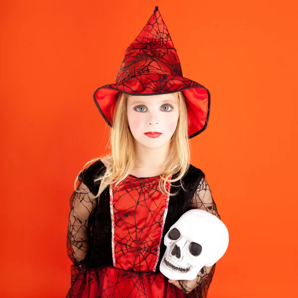 Хеллоуїн дівчинка костюм на помаранчевому — стокове фото