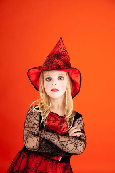 Halloween kid girl costume on orange — Stock Photo, Image