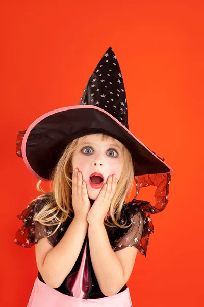 Halloween kid girl costume on orange Stock Image