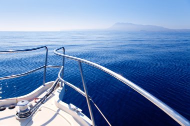 Boat bow sailing in blue Mediterranean sea clipart