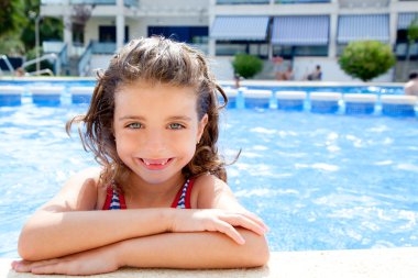 Happy kid girl smiling at swimming pool clipart