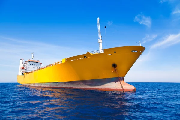 Anchor cargo yellow boat in blue sea — Stock Photo, Image