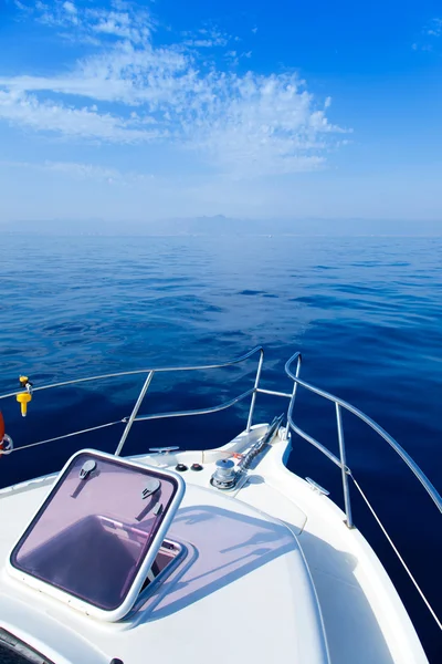 Blue sea boat sailing with open bow porthole — Stock Photo, Image