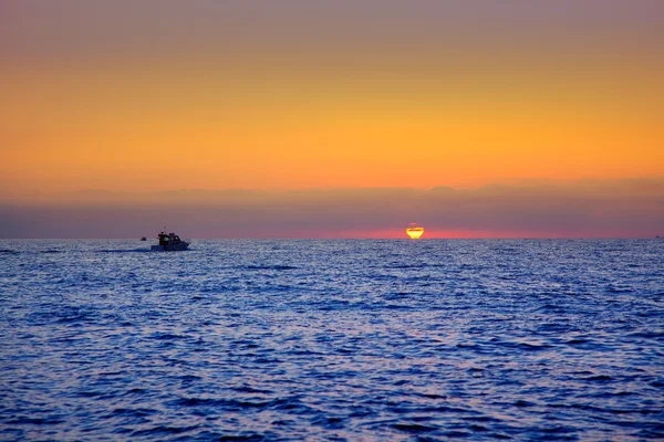 Blue sea sunrise with sun in horizon — Stock Photo, Image