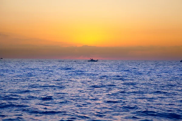 Blue sea sunrise with sun in horizon — Stock Photo, Image