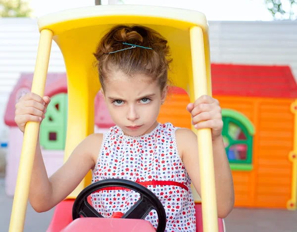 Angry toy car driver children girl — Stock Photo, Image