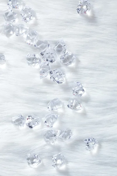 Crystal ice cubes on winter white fur — Stock Photo, Image