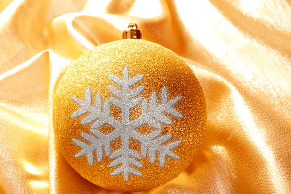 Christmas glitter golden snowflake bauble — Stock Photo, Image