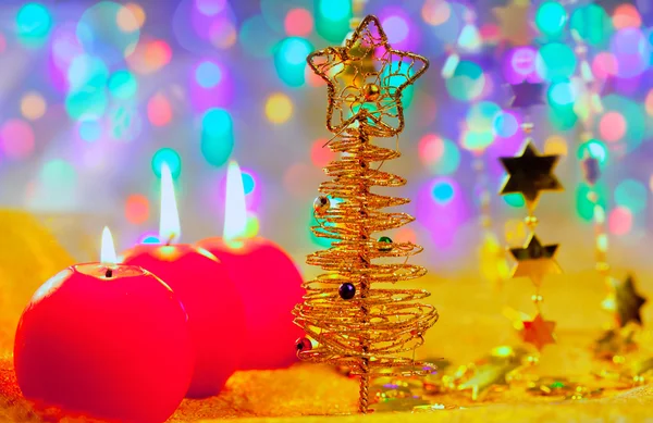 Christmas golden tree baubles and candles — Stock Photo, Image