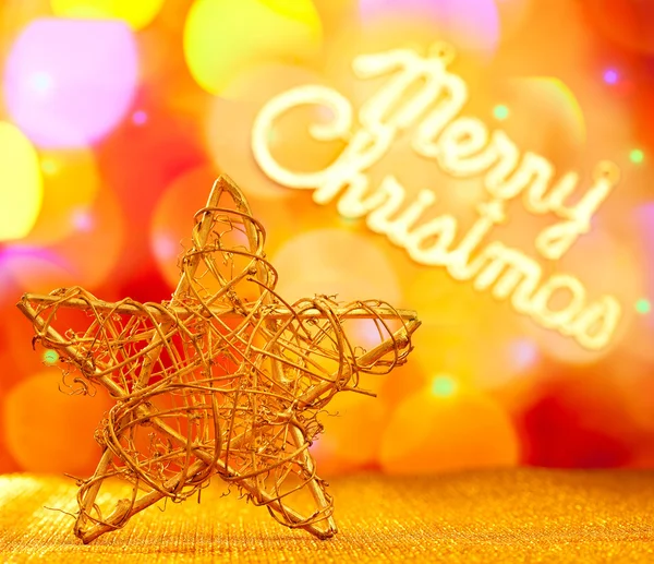 Golden star with Merry Christmas written — Stock Photo, Image