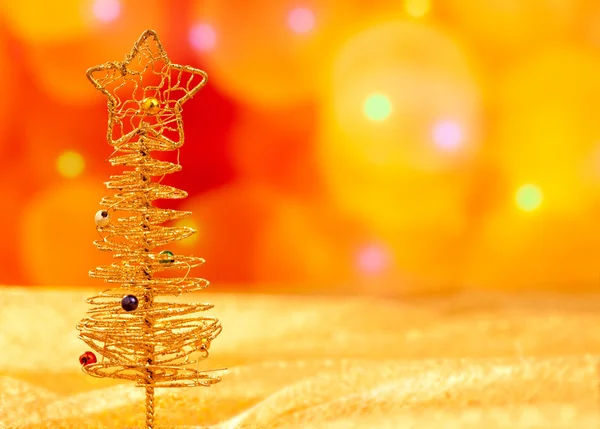 Christmas golden wire tree in blurred lights — Stock Photo, Image