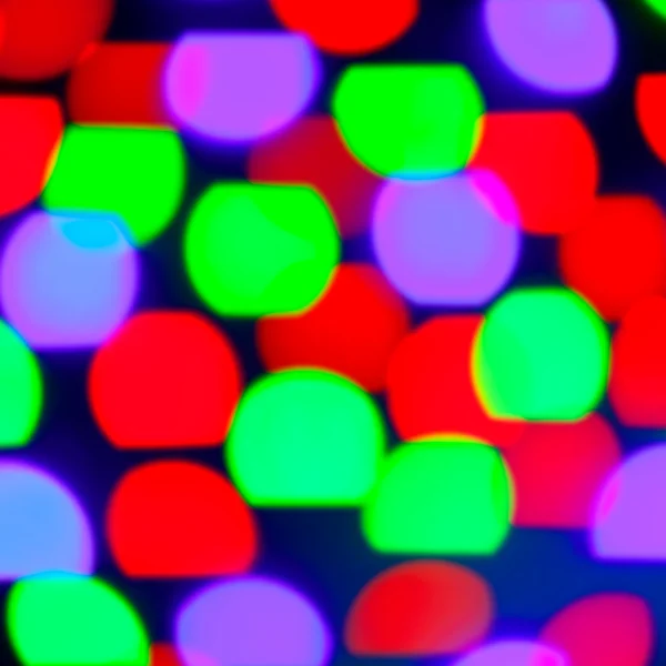 Glowing bokeh colorful lights in black — Stock Photo, Image