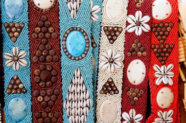 Colorful handcrafted belts with sea shells clipart