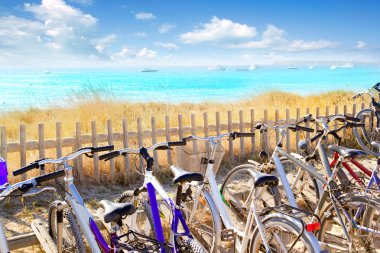 Bicycles parking at Formentera beach clipart