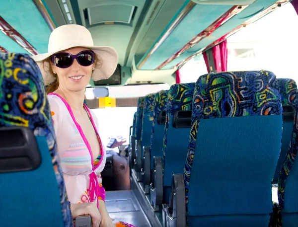 Girl on tourist bus happy with sunglasses — Stock Photo, Image