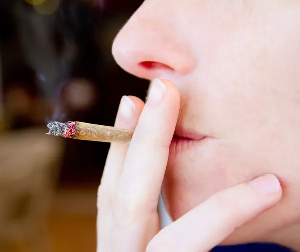 Smoking joint closeup with smoke — Stock Photo, Image