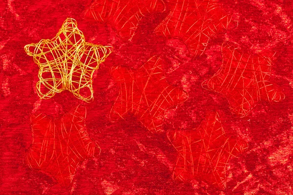 Gouden Kerstster van draad over rood — Stockfoto