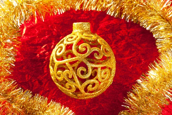Christmas card golden bauble and tinsel — Stock Photo, Image
