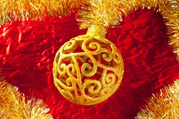 Christmas card golden bauble and tinsel — Stock Photo, Image