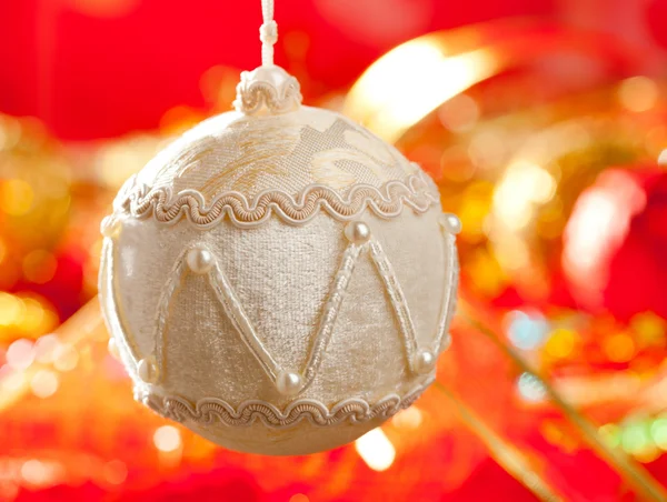 Christmas card of white velvet bauble on red — Stock Photo, Image