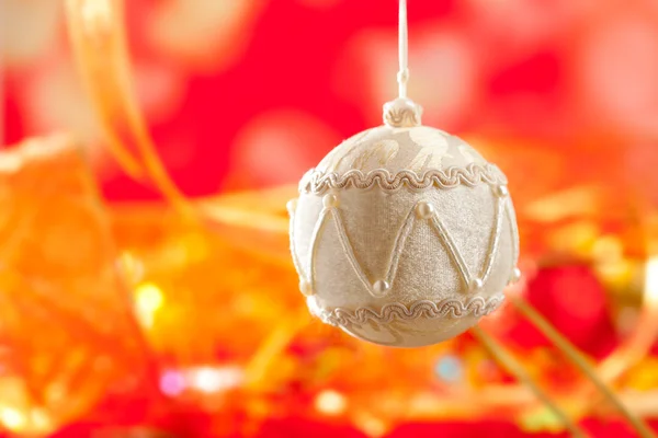 Christmas card of white velvet bauble on red — Stock Photo, Image