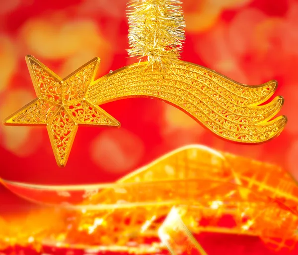 Vánoční betlém kometa Zlatá hvězda na červené — Stock fotografie