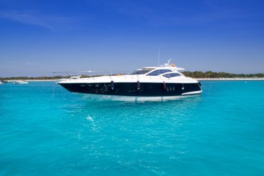 Yatch in turquoise beach of Formentera clipart