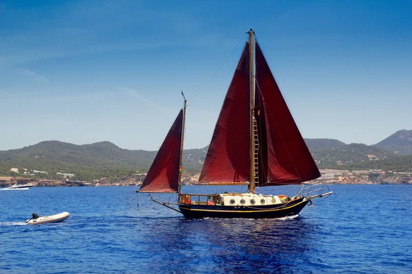 stock image Ibiza Red sails sailboat in Sa Talaia coast