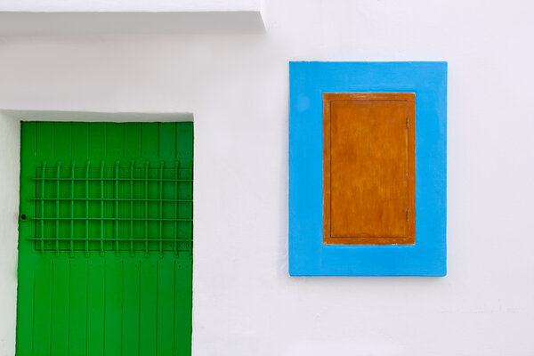 Ibiza white house detail of green door and blue window