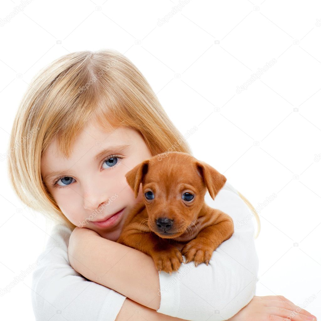 Blond children girl with dog puppy mini pinscher