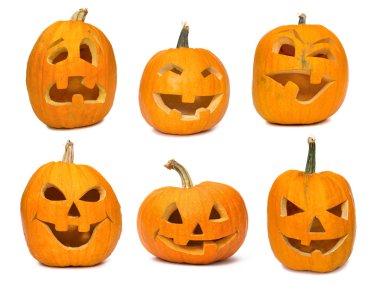 Carved Jack-o-lanterns lit for Halloween clipart