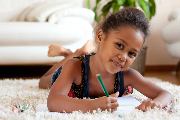 Little African Asian girl drawing — Stock Photo, Image
