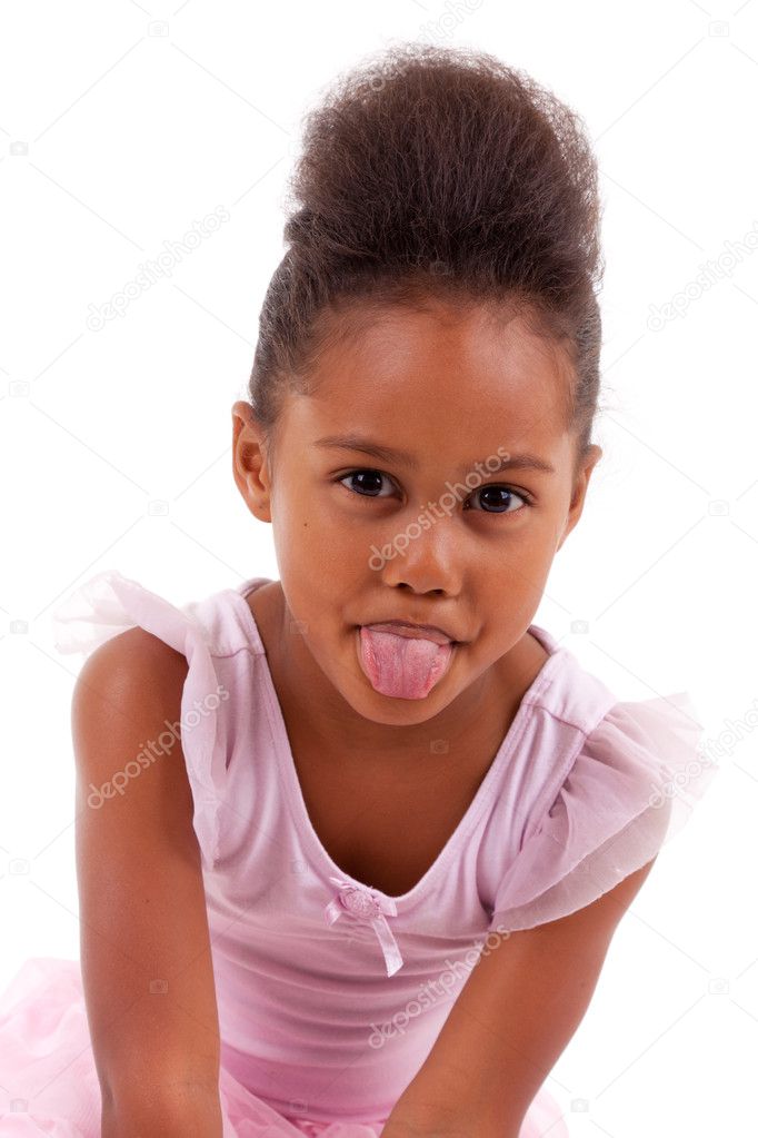 Cute little African Asian girl sticking tongue out