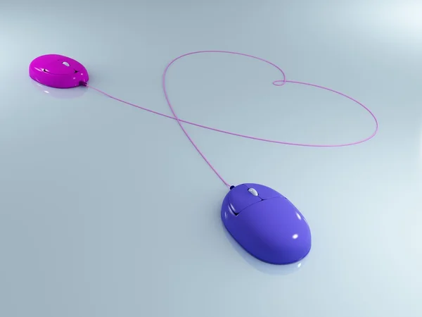 Deux souris d'ordinateur avec des fils en forme de coeur — Photo
